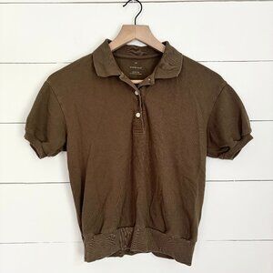 Everlane olive green polo shirt with band around the bottom